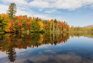 view of fall foliage on Lake George NY