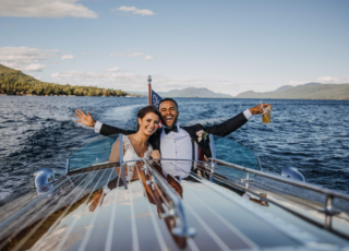 Married couple on a boat on Lake George: Adirondack wedding venues